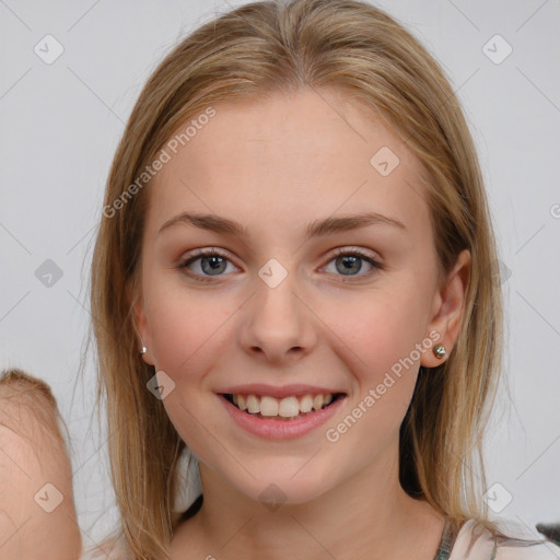 Joyful white young-adult female with medium  brown hair and blue eyes