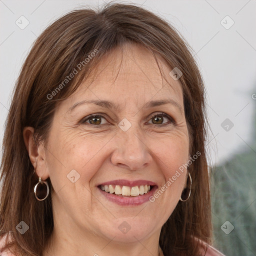 Joyful white adult female with long  brown hair and brown eyes