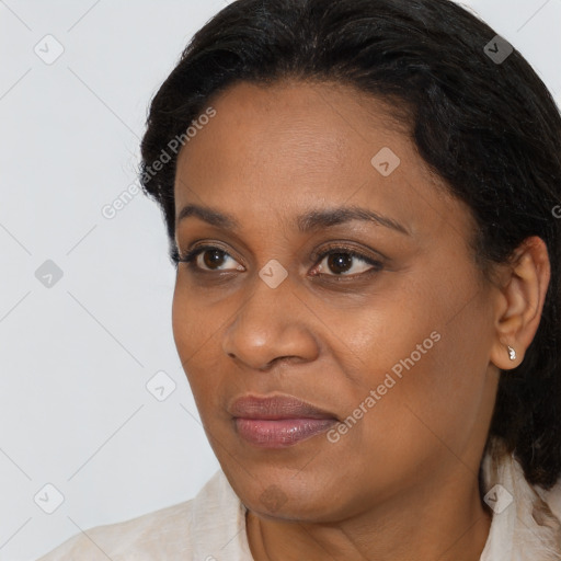 Joyful black young-adult female with medium  brown hair and brown eyes