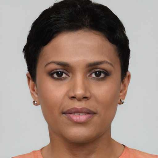 Joyful asian young-adult female with short  black hair and brown eyes