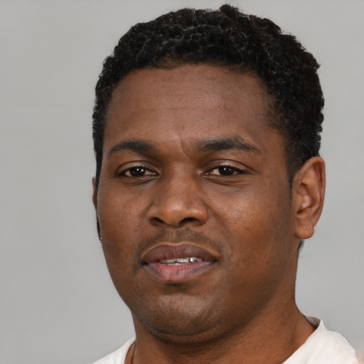 Neutral black young-adult male with short  black hair and brown eyes