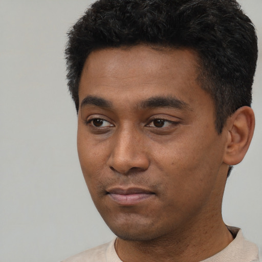 Neutral black young-adult male with short  black hair and brown eyes