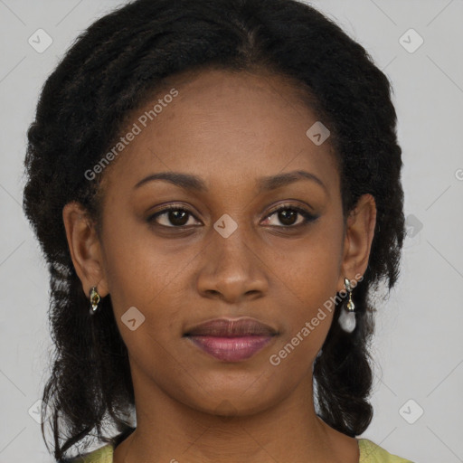 Joyful black young-adult female with long  brown hair and brown eyes