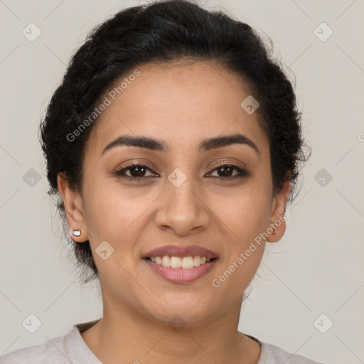 Joyful latino young-adult female with short  brown hair and brown eyes