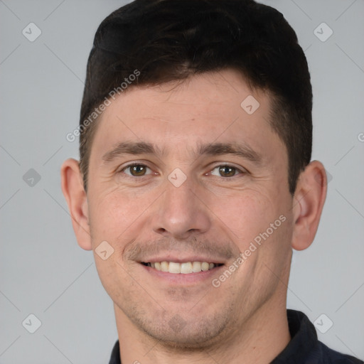 Joyful white young-adult male with short  brown hair and brown eyes