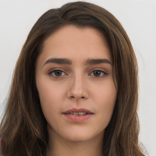 Neutral white young-adult female with long  brown hair and brown eyes