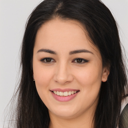 Joyful white young-adult female with long  brown hair and brown eyes