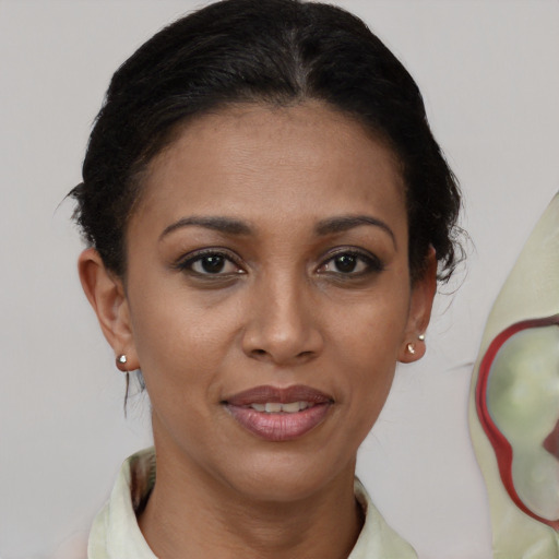 Joyful black young-adult female with short  brown hair and brown eyes