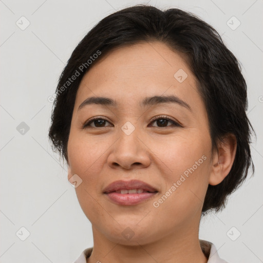 Joyful asian young-adult female with medium  brown hair and brown eyes