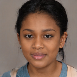 Joyful black young-adult female with medium  brown hair and brown eyes