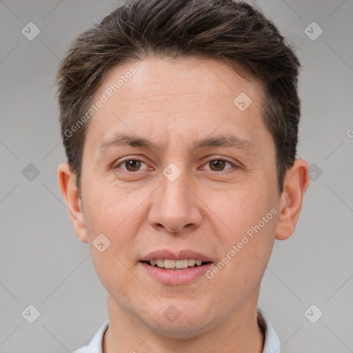 Joyful white adult male with short  brown hair and brown eyes