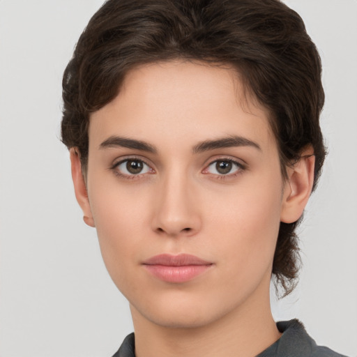 Neutral white young-adult female with short  brown hair and brown eyes