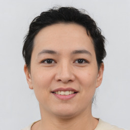 Joyful asian young-adult female with short  brown hair and brown eyes