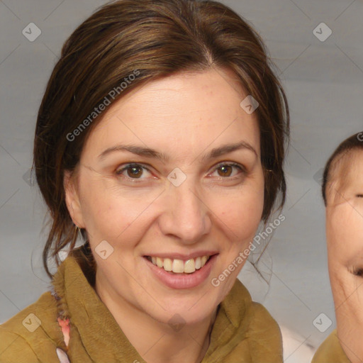 Joyful white adult female with medium  brown hair and brown eyes