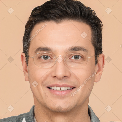 Joyful white adult male with short  brown hair and brown eyes