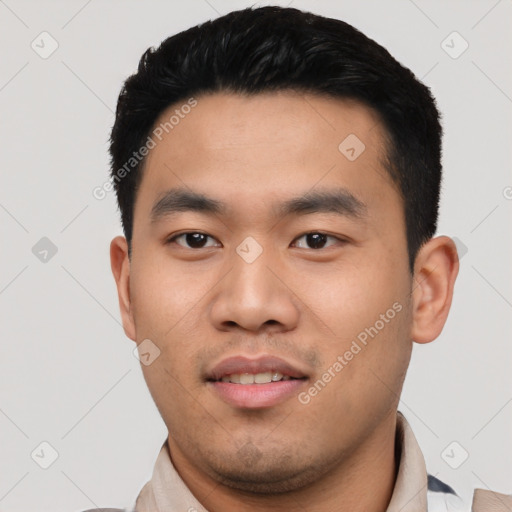 Joyful asian young-adult male with short  black hair and brown eyes