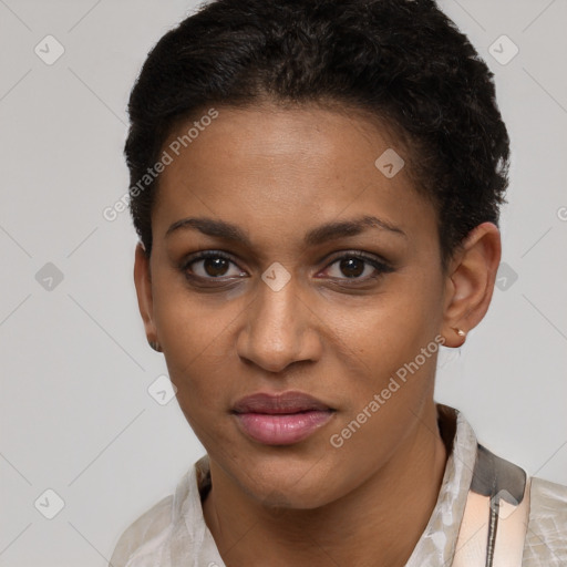 Joyful black young-adult female with short  brown hair and brown eyes