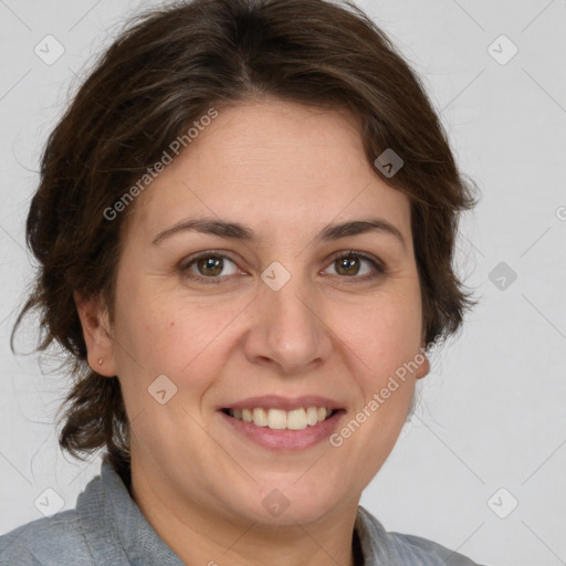 Joyful white adult female with medium  brown hair and green eyes