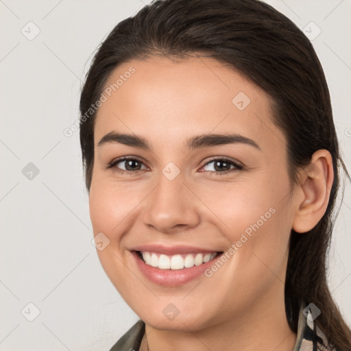 Joyful white young-adult female with medium  brown hair and brown eyes