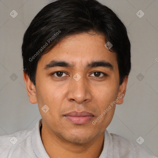 Joyful white young-adult male with short  black hair and brown eyes