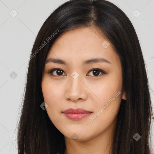 Joyful asian young-adult female with long  brown hair and brown eyes