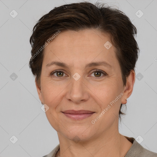 Joyful white adult female with short  brown hair and brown eyes