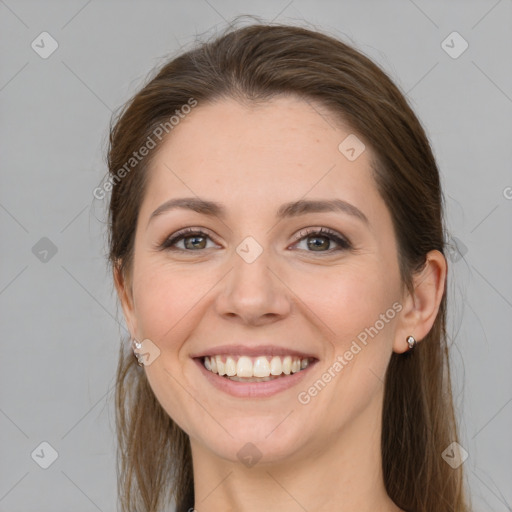 Joyful white young-adult female with long  brown hair and grey eyes