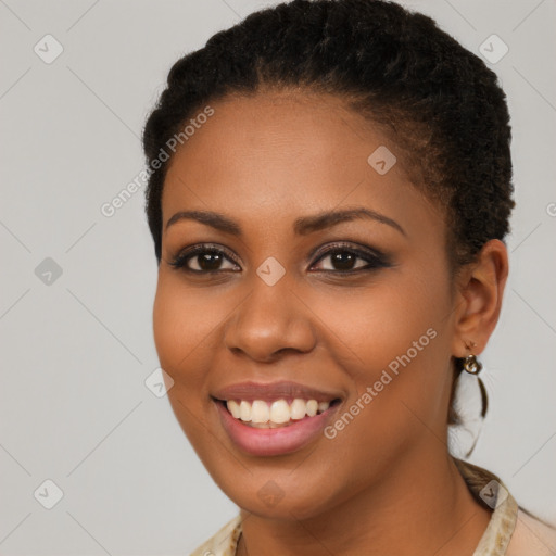 Joyful black young-adult female with short  brown hair and brown eyes