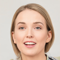 Joyful white young-adult female with medium  brown hair and green eyes