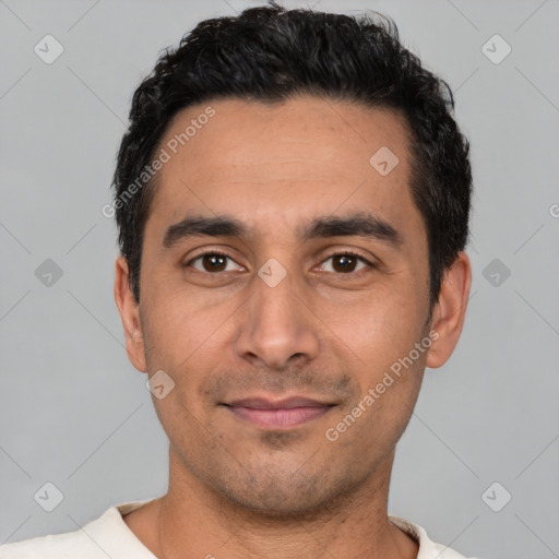 Joyful white young-adult male with short  black hair and brown eyes