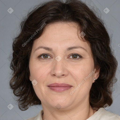 Joyful white adult female with medium  brown hair and brown eyes