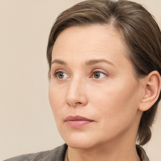 Neutral white young-adult female with medium  brown hair and grey eyes