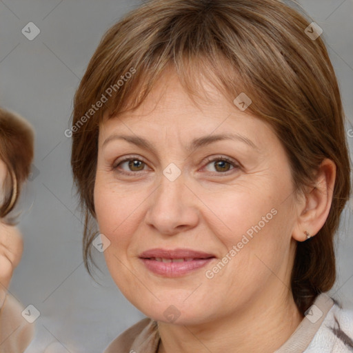 Joyful white adult female with medium  brown hair and brown eyes