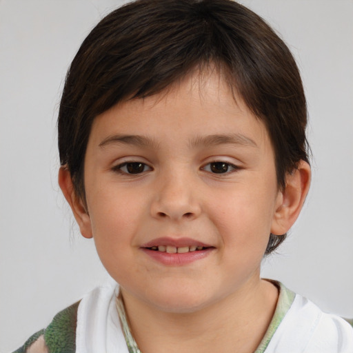 Joyful white child female with short  brown hair and brown eyes