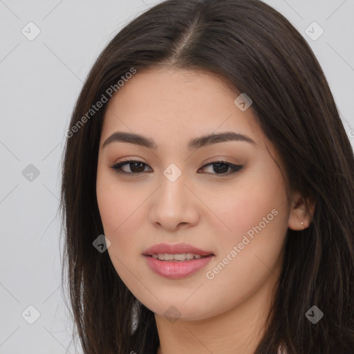 Joyful asian young-adult female with long  brown hair and brown eyes