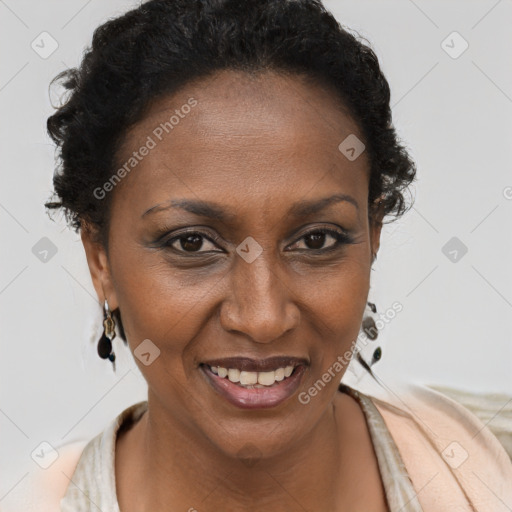 Joyful black adult female with short  brown hair and brown eyes