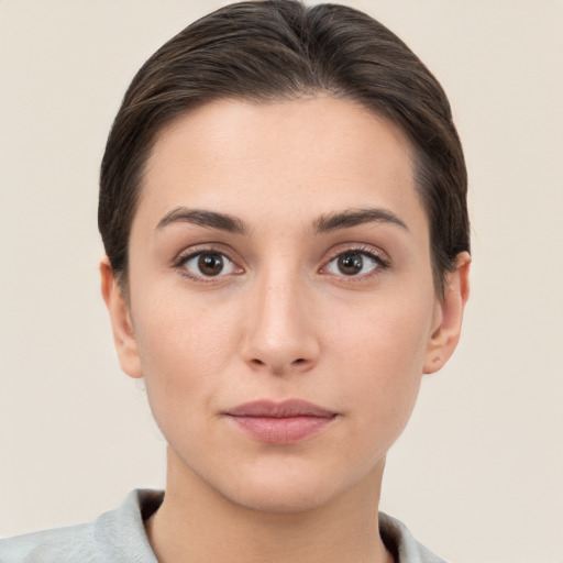 Neutral white young-adult female with short  brown hair and brown eyes