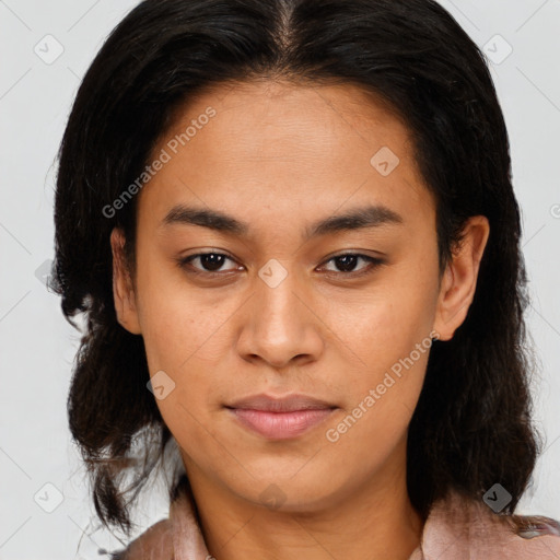 Joyful latino young-adult female with medium  brown hair and brown eyes