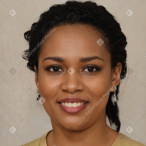 Joyful black young-adult female with long  black hair and brown eyes