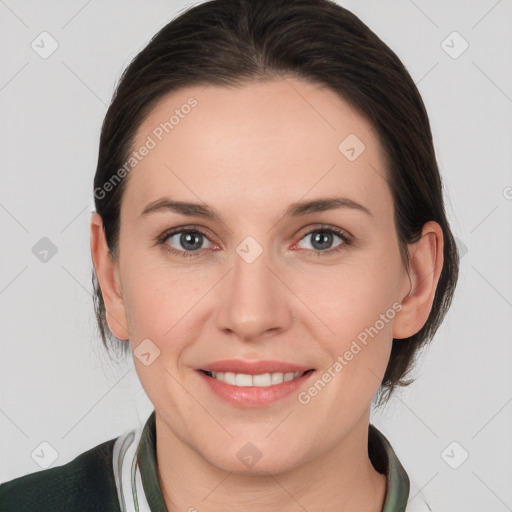 Joyful white young-adult female with medium  brown hair and grey eyes