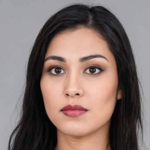 Neutral latino young-adult female with long  black hair and brown eyes
