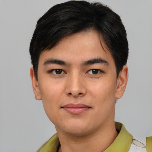 Joyful asian young-adult male with short  brown hair and brown eyes