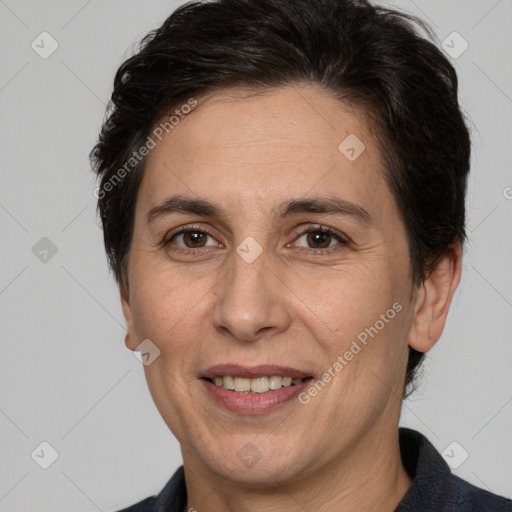 Joyful white adult female with medium  brown hair and brown eyes