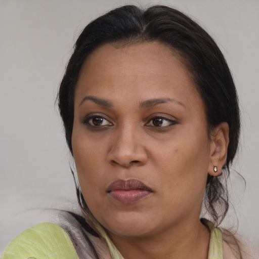 Joyful asian adult female with medium  brown hair and brown eyes