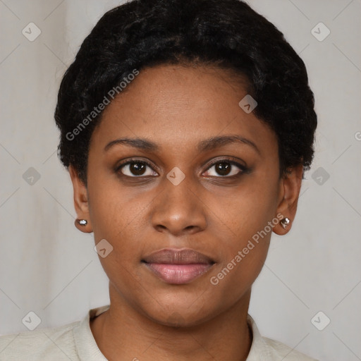 Joyful black young-adult female with short  black hair and brown eyes