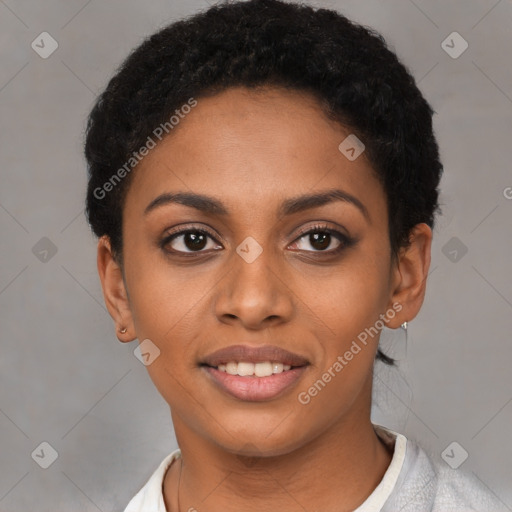 Joyful black young-adult female with short  black hair and brown eyes