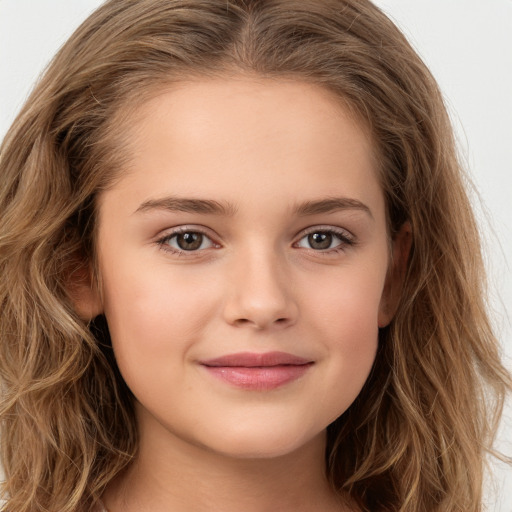 Joyful white child female with long  brown hair and brown eyes