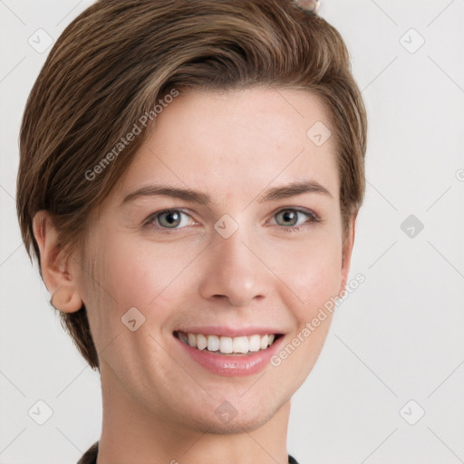 Joyful white young-adult female with short  brown hair and grey eyes