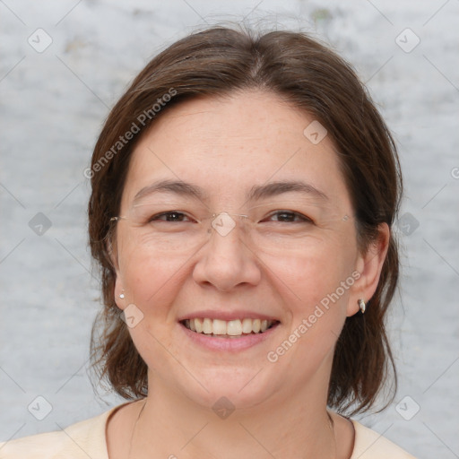 Joyful white adult female with medium  brown hair and brown eyes