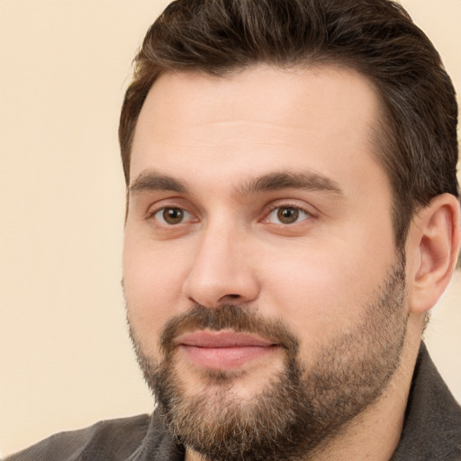 Joyful white young-adult male with short  brown hair and brown eyes